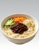 Zhajiangmian (Beijing-Style Soybean Paste Noodles)Classic Beijing-style noodles topped with thick, savory soybean paste sauce, served with fresh julienned cucumber, carrots, and bean sprouts.